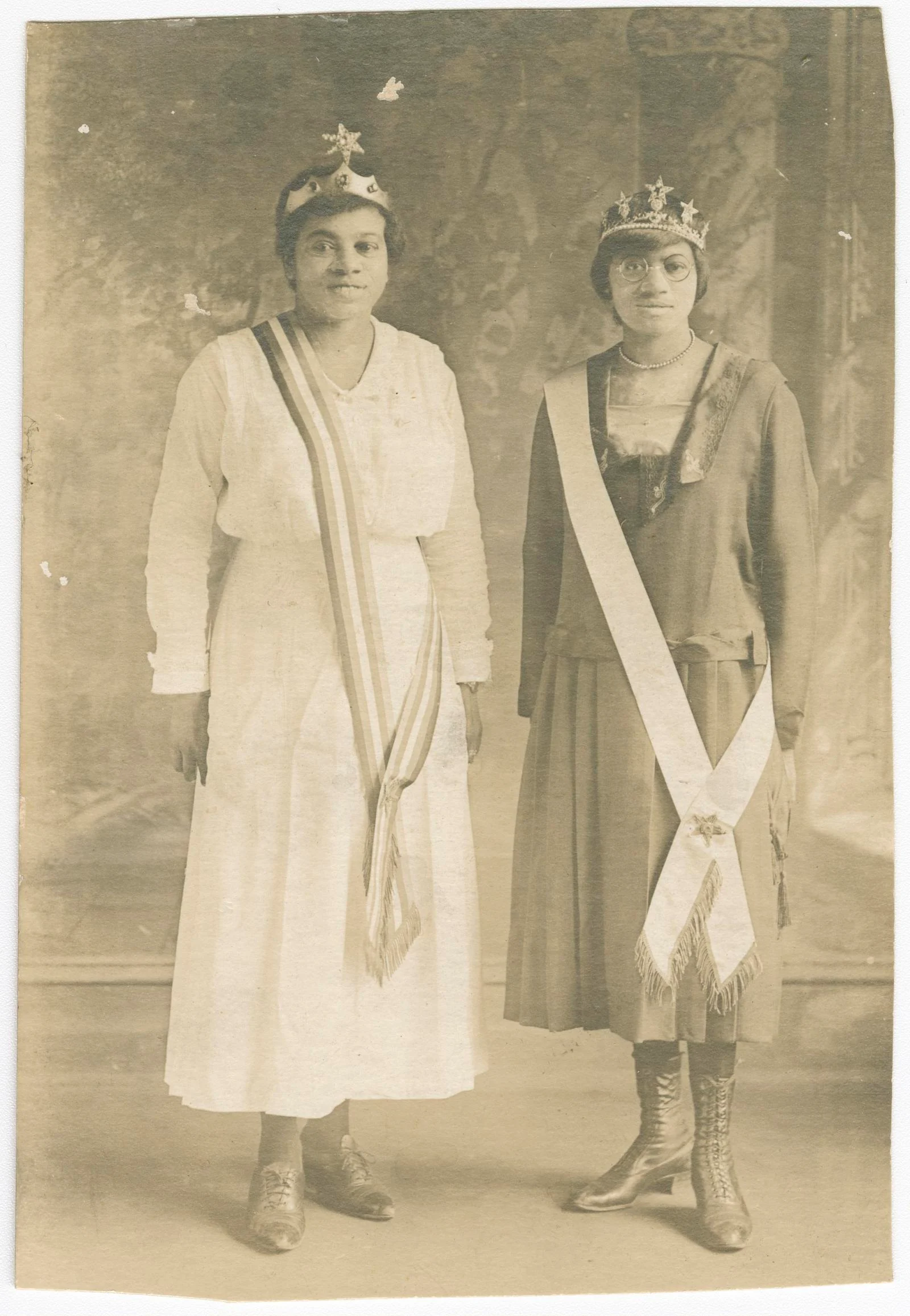Magdalene Hendricks, at right, and her sister wearing Eastern Star sashes and crowns in an early 1920s studio portrait.